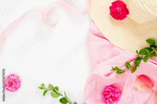 Fototapeta Naklejka Na Ścianę i Meble -  Flat lay fashion office table desk. Female workspace straw hat, rose flower buds, gift box, branches on white background. Top view feminine background with copy space for text.