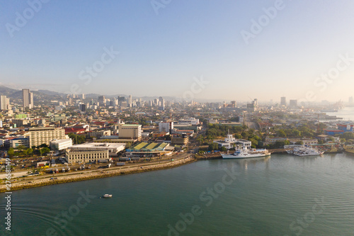 Cityscape in the morning. The streets and houses of the city of Cebu, Philippines, top view. Panorama of the city with houses and business centers. © Tatiana Nurieva