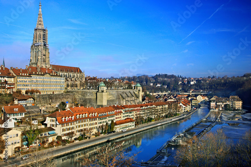 View of the Old Town (Altstadt) of Bern (capital of Switzerland) and river Aare with the Bell Tower of the Münster (cathedral) standing out. 