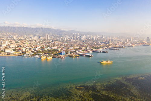 Cityscape in the morning. Streets and seaport of the city of Cebu, Philippines, top view. Panorama of the city with houses and business centers.