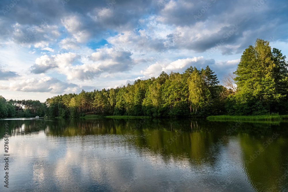 lake surrounded by forest lake surrounded by forest