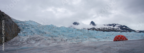 Helicopter Flying Above an Icy Glacier photo