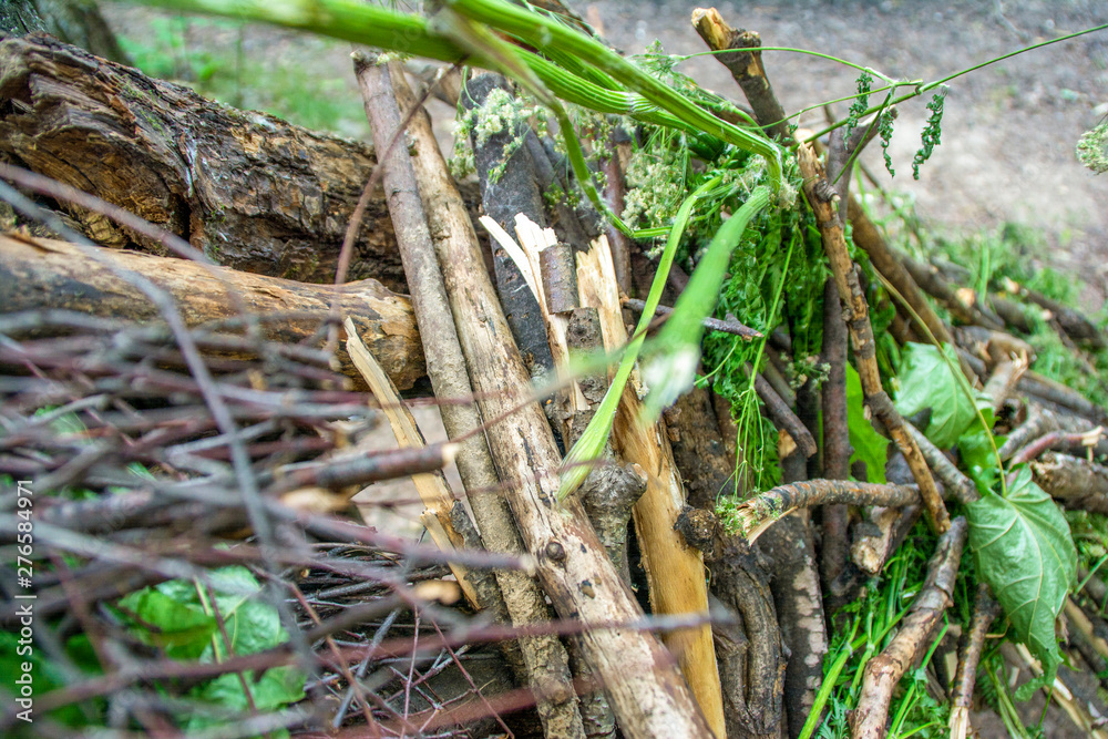 The texture of a homemade hut from a pile of dry sticks and old foliage The texture of a homemade hut from a pile of dry sticks and old foliage