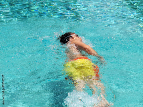 close up teenager boy swimming at swimming pool