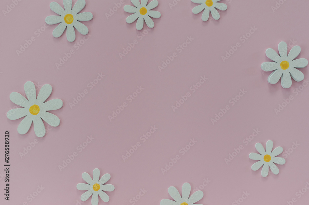 Beautiful pink background with daisies. Texture for creative ideas. The concept of lightness and minimalism in design Beautiful pink background with daisies. Texture for creative ideas. The concept of lightness and minimalism in design