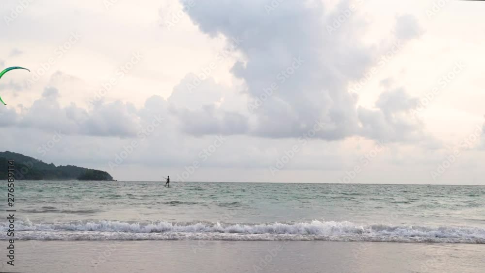 Tropical beach evening view, of the plane is down near the airport. tropical white sand beach. Sea waves seamless loop on the beautiful sand beach,Phuket Thailand. Tropical beach evening view, of the plane is down near the airport. tropical white sand beach. Sea waves seamless loop on the beautiful sand beach,Phuket Thailand.