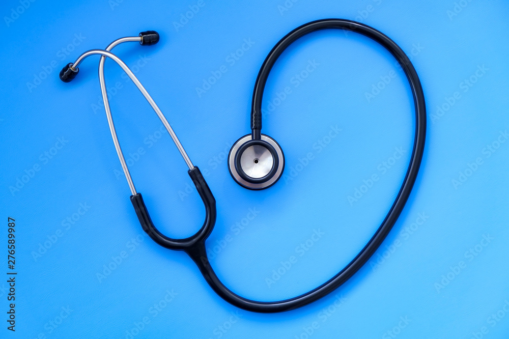 Medical stethoscope on a blue background. Hospital and doctor's office. Listening to breathing and heartbeat. Medical stethoscope on a blue background. Hospital and doctor's office. Listening to breathing and heartbeat.