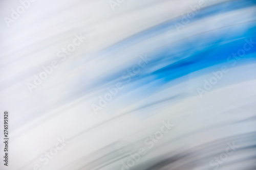 Defocused dynamic abstract blue background. Motion effect decorative backdrop. Natural summer blurry light and dark blue texture. Fresh no focus creative wallpaper