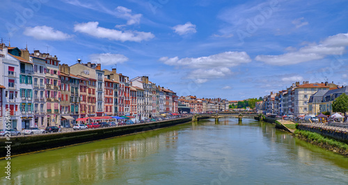 View of Nive River and typical basque architecture on houses each side. Bayonne, France June 2019