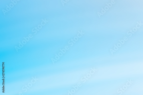 Abstract blue and white gradient background. Blurry defocused natural backdrop with bokeh lights. Soft summer, spring vibrant color and smooth wallpaper. Horizontal peaceful decorative image