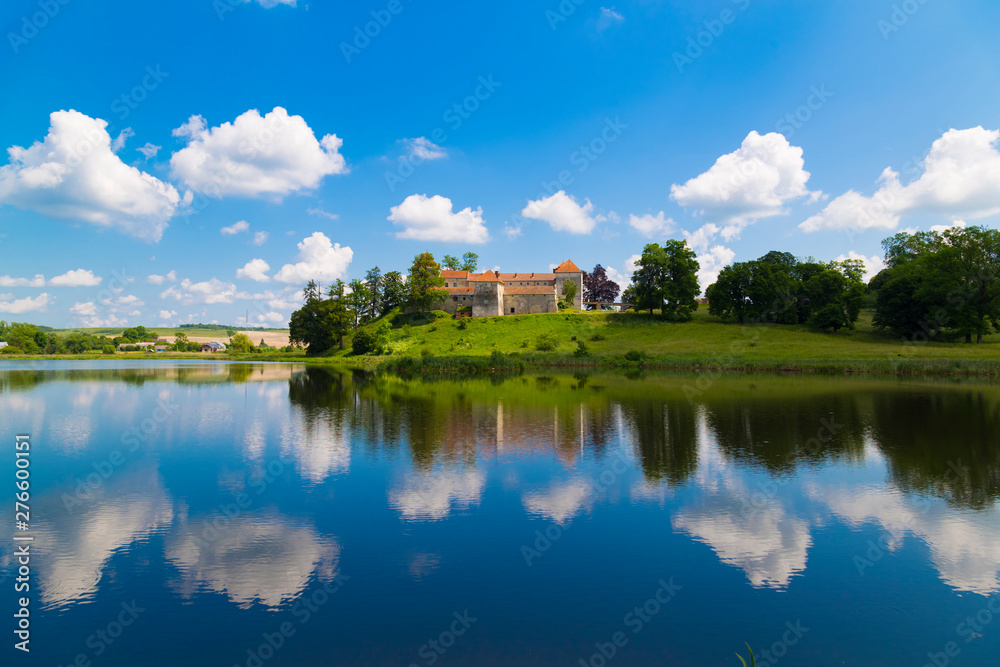 Old beautiful Svirzh castle, surrounded by lake . Ukraine Old beautiful Svirzh castle, surrounded by lake . Ukraine