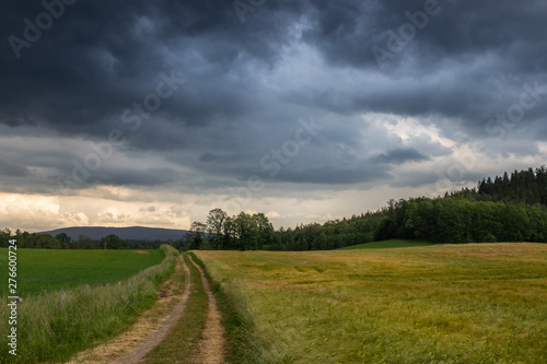 Road on polish countryside before the storm