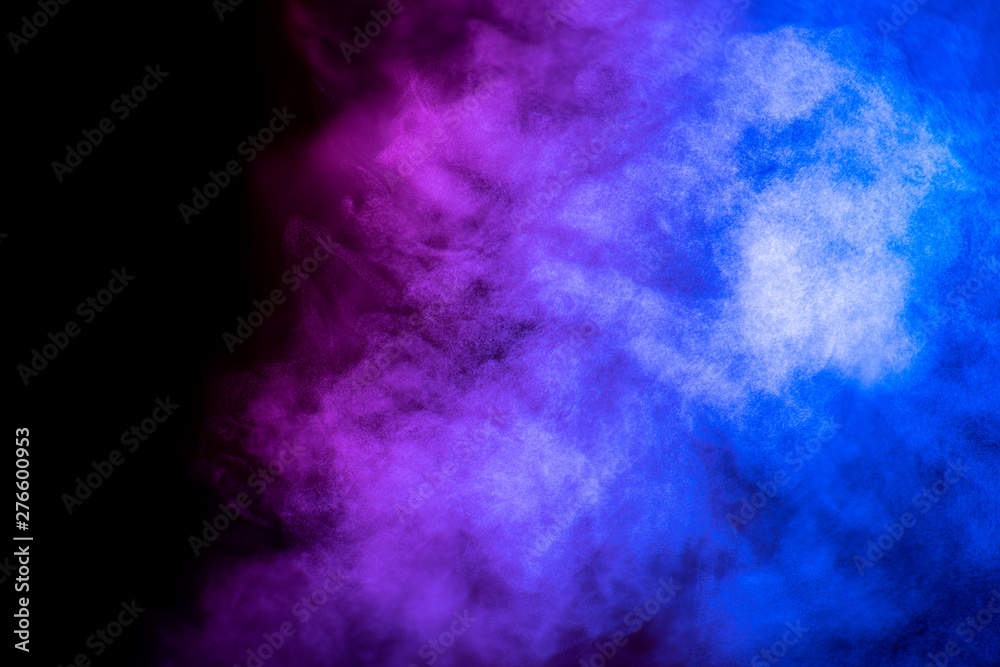 Bright blue and purple smoke isolated on black background