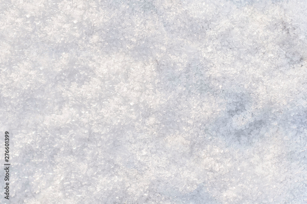 winter background, snow texture. snowflakes close up. shiny snowflakes in the rays of the sun winter background, snow texture. snowflakes close up. shiny snowflakes in the rays of the sun