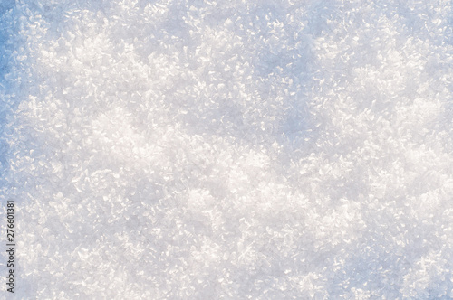 winter background, snow texture. snowflakes close up. shiny snowflakes in the rays of the sun