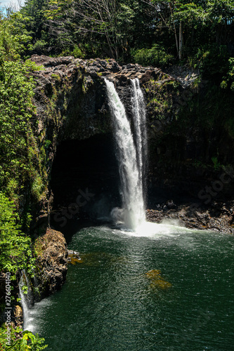 waterfall in deep forest in hawaii