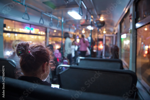 People in old public bus, view from inside the bus . People sitting on a comfortable bus in Selective focus and blurred background. s the main mass transit passengers in the bus.