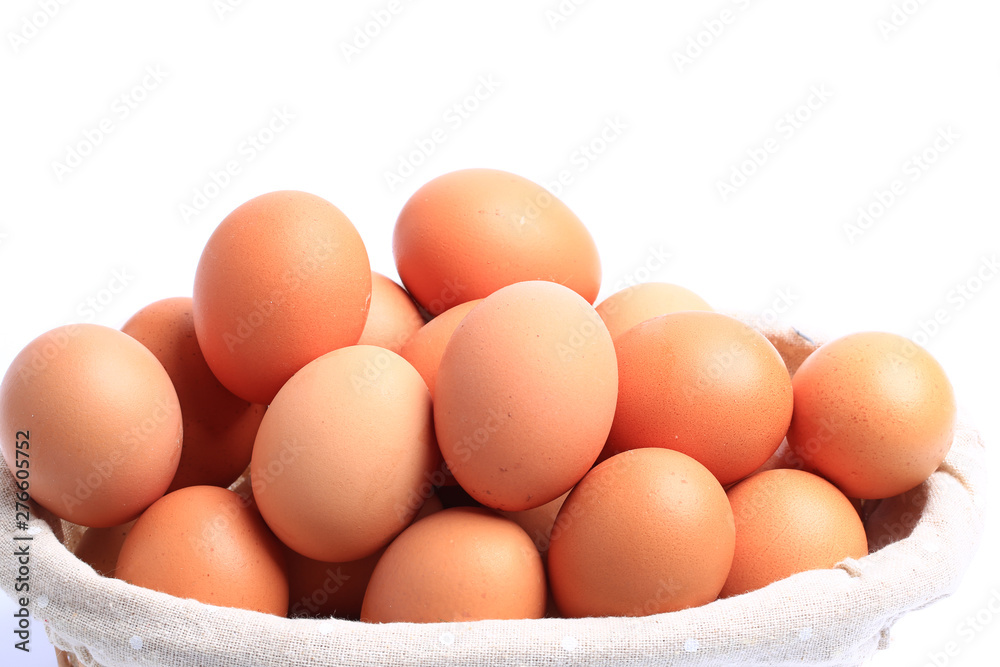 chicken eggs in basket isolated on white background