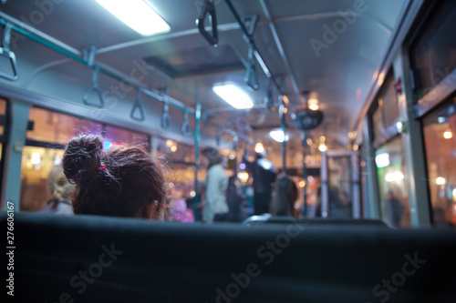 İs the main mass transit passengers in the bus. People in old public bus, view from inside the bus . People sitting on a comfortable bus in Selective focus and blurred background.