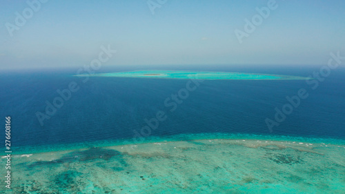 Tropical islands and coral atolls with blue water of the sea, aerial view. Balabac, Palawan, Philippines. Summer and travel vacation concept.
