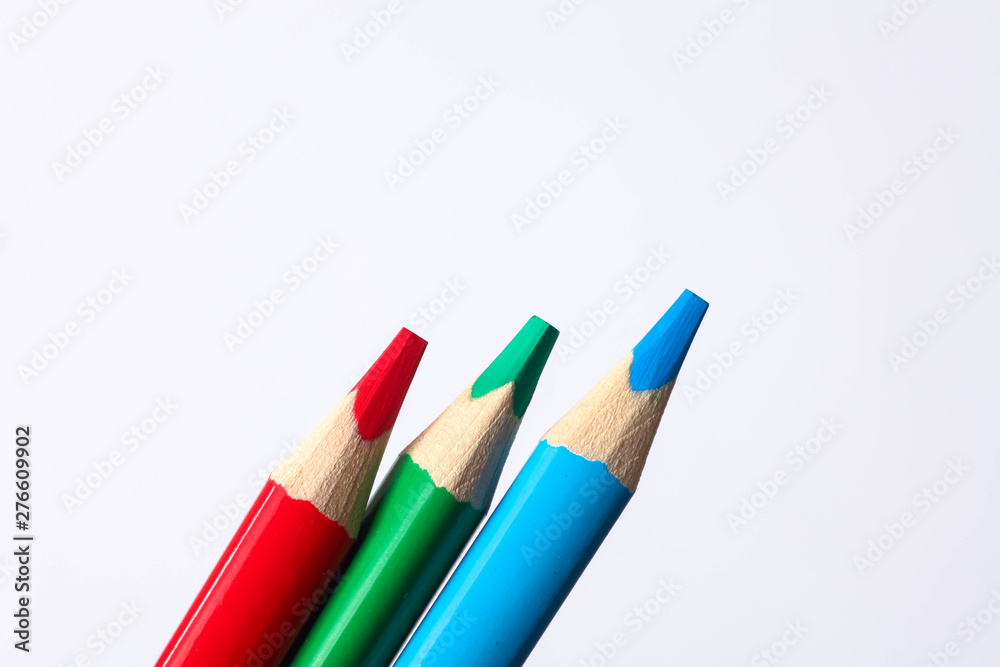 set of colored pencils on a white background