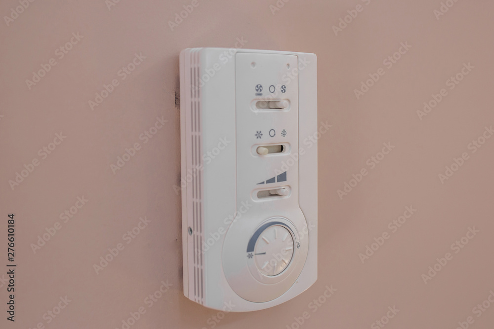 Indicator of the old generation air conditioner in an office building with a control panel, side view Indicator of the old generation air conditioner in an office building with a control panel, side view