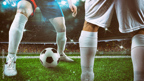 Quadro em tela Close up of a soccer player holding the ball for a dribbling at the stadium duri