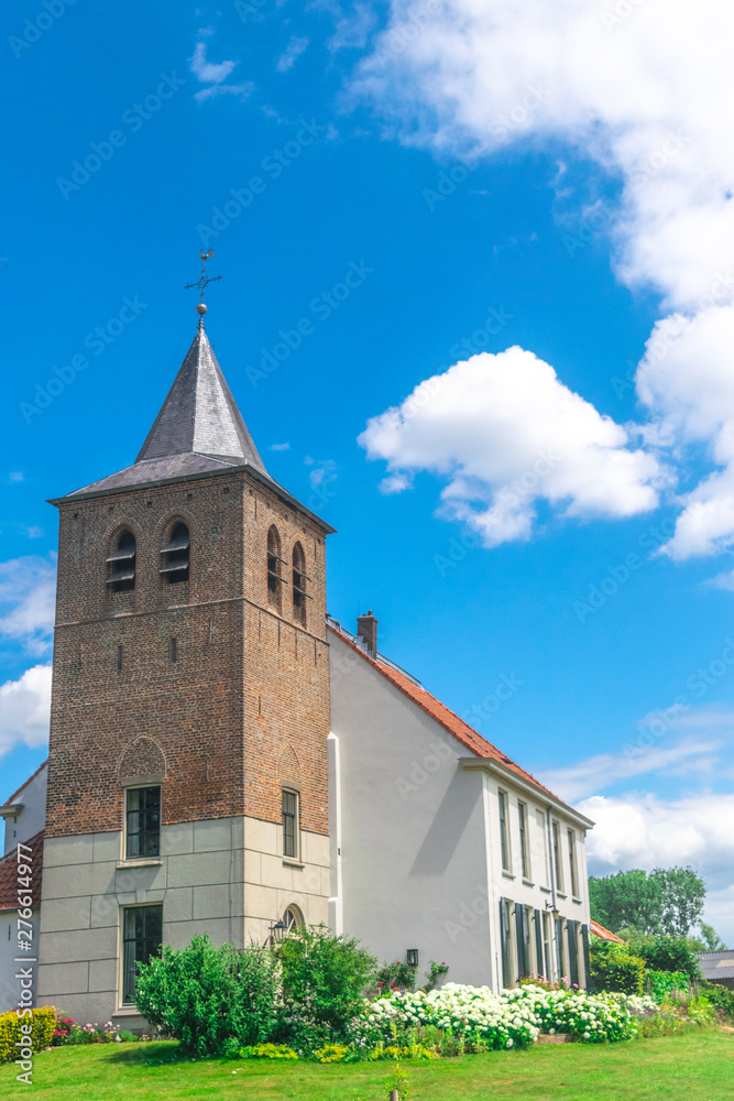 A old traditional Dutch church in the village of Ooij, Holland