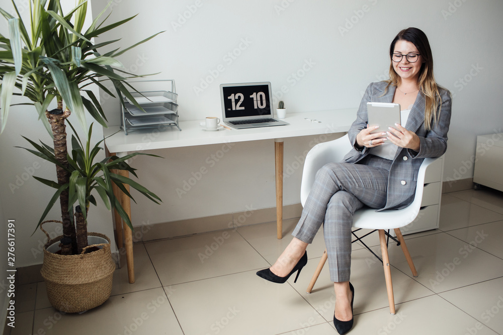 younger girl working in the office at the table