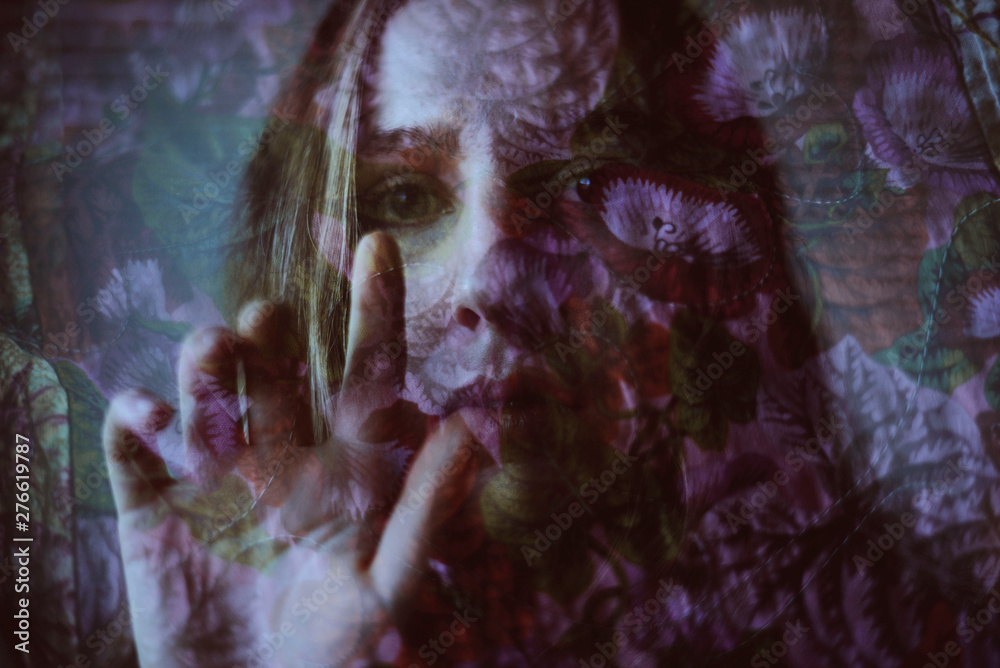 Floral double exposure portrait of young woman 