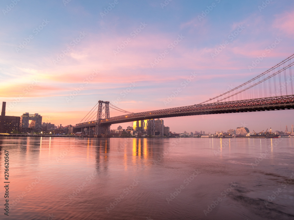 Wide Angle View of the Williamsburg Bridge During Sunrise With Clear Skies