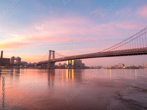 Wide Angle View of the Williamsburg Bridge During Sunrise With Clear Skies © porqueno