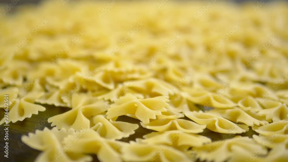 raw pasta. Farfalle closeup on wooden table raw pasta. Farfalle closeup on wooden table
