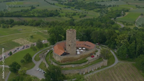 Aerial of the town Weiler beside the castle Steinsberg in Germany. Fleight over the castle. photo