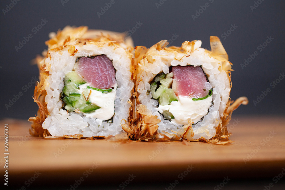 Sushi roll with salmon, cheese and cucumb Sushi roll with salmon, cheese and cucumb