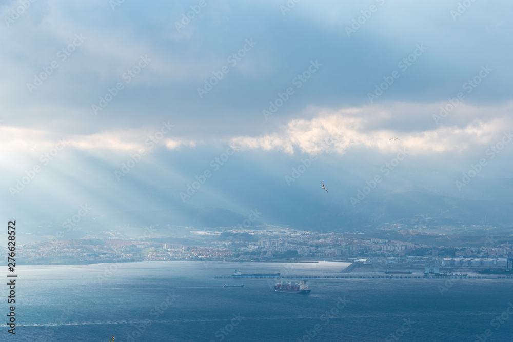 A panoramic view of the industrial port city of Algeciras taken from the Rock of Gibraltar during an overcast sky A panoramic view of the industrial port city of Algeciras taken from the Rock of Gibraltar during an overcast sky