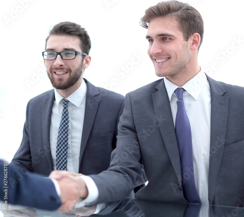 smiling Manager shaking hands with client