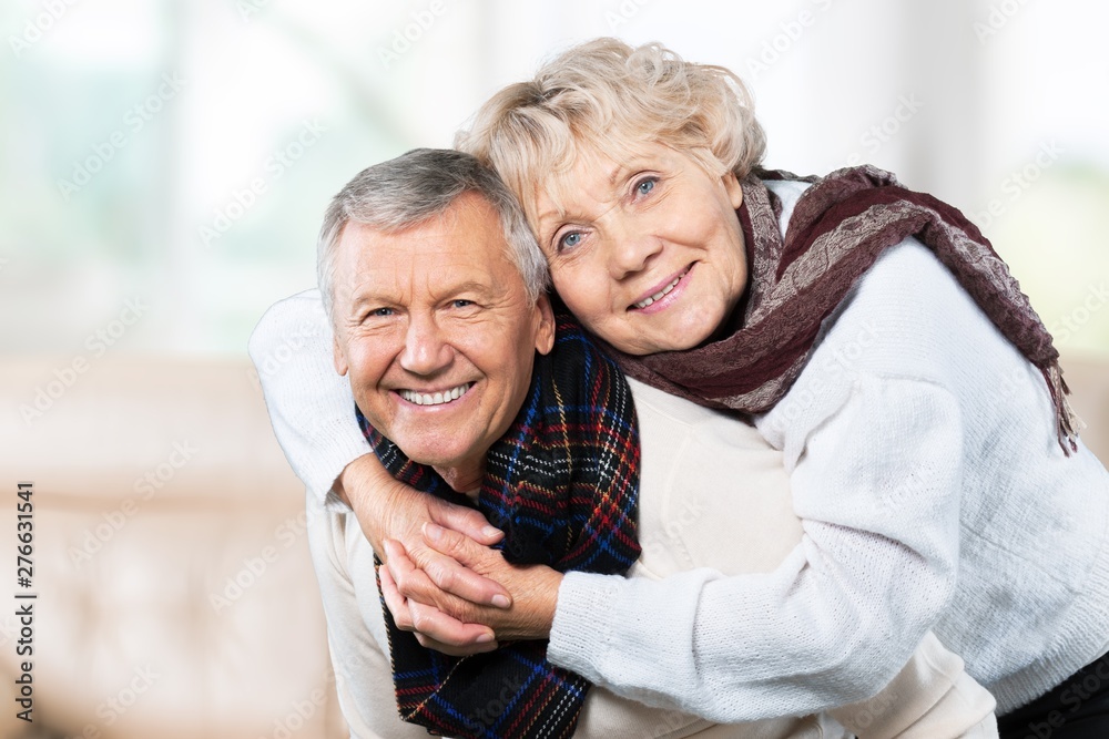 Portrait of happy senior couple smiling at home Portrait of happy senior couple smiling at home