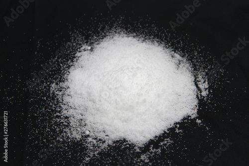 Salt pile. White sugar powder heap vector illustration on black background 