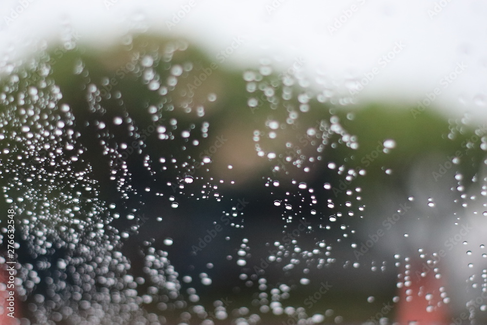 water drops on glass of car