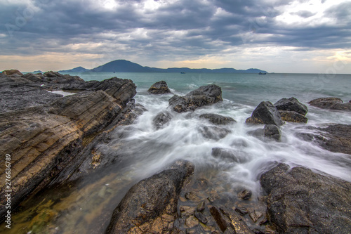 Sea dawn with waves and rocks at nha trang
