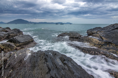 Sea dawn with waves and rocks at nha trang