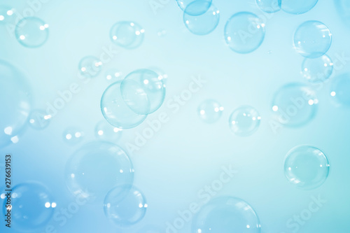 Blue soap bubbles background.