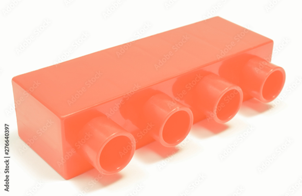 Fototapeta premium Red toy block for children on white background.