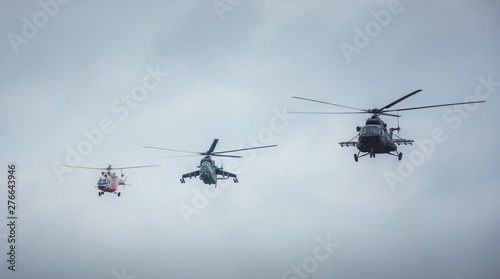 Military helicopters flying towards the action. Rescue, assault and cargo helicopter.
