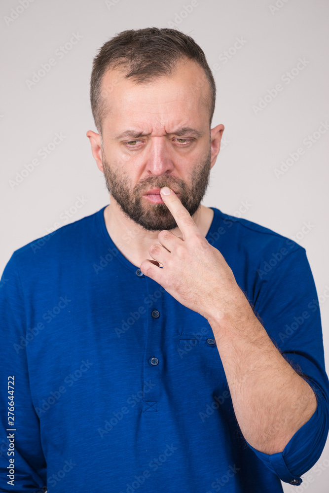 Confused focused serious man thinking Confused focused serious man thinking