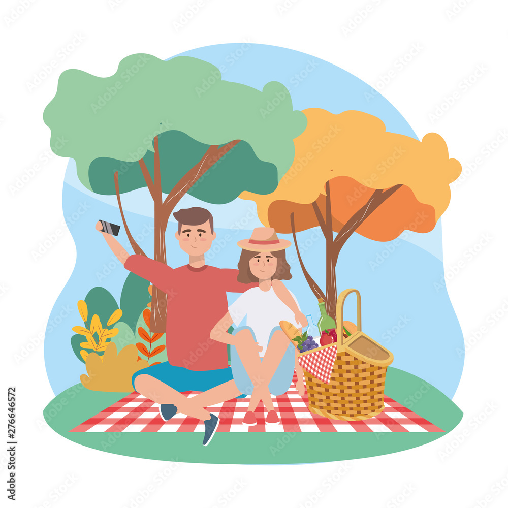 woman and man with smartphone selfie and food in the hamper