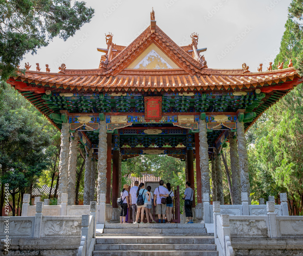 Pavilion in the Confucian Temple (Wenmiao) with lotus, Jianshui, Yunnan, China. One of the biggest and oldest Confucian temples. National heritage. Pavilion in the Confucian Temple (Wenmiao) with lotus, Jianshui, Yunnan, China. One of the biggest and oldest Confucian temples. National heritage.