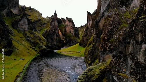 canyon valley in iceland. Fjadrargljufur. Drone shot, motion backwards from inside the cannyon photo