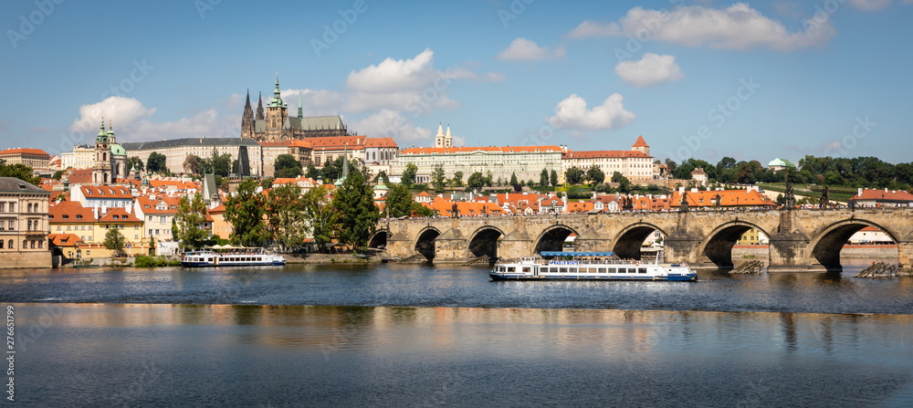 Charles Bridge, palace and the Vltava River in Prague, Czech Republic.